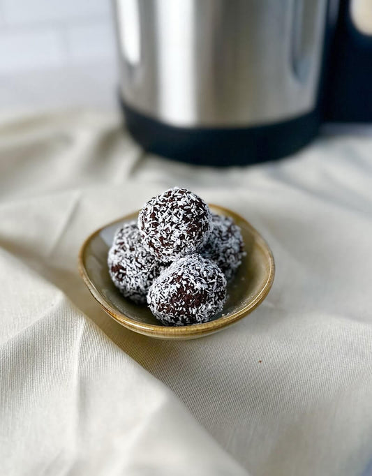 Chocolate balls rolled in coconut flakes